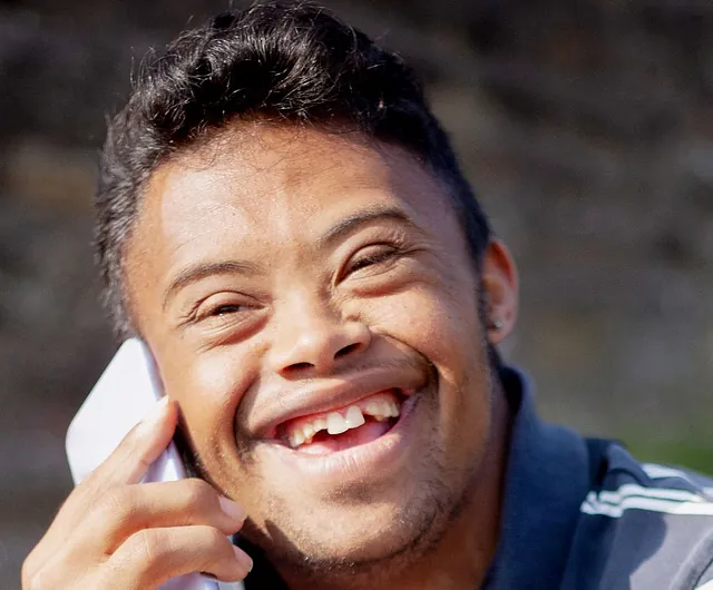 Person with Down Syndrome on the phone